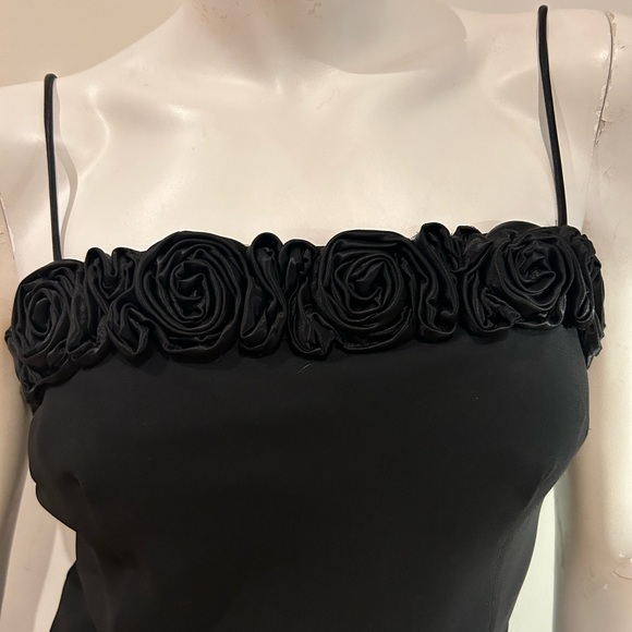 Long black dress with rosette trim across bust. - Picture 2 of 5